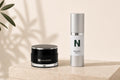 NAIZOR Active Eye Cream and Age Defying Serum together on a travertine plinth