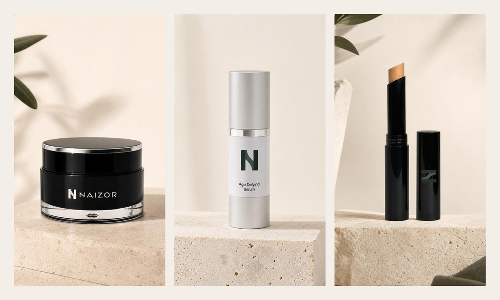 NAIZOR Active Eye Cream, Age Defying Serum and Creme Concealer Stick, side by side on travertine