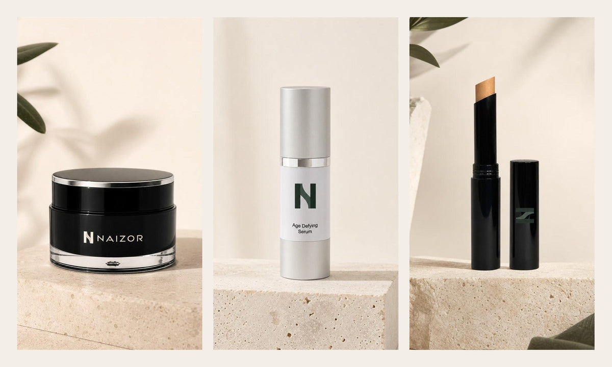 NAIZOR Active Eye Cream, Age Defying Serum and Creme Concealer Stick, side by side on travertine
